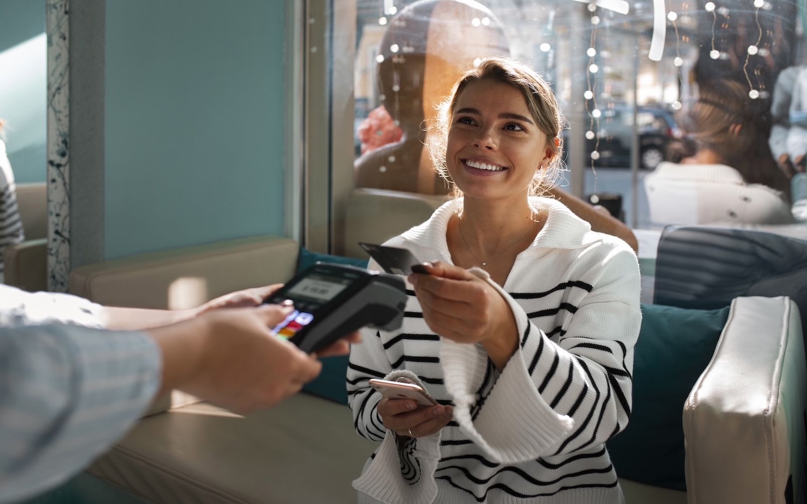 Business owner paying with contactless terminal
